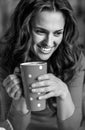 Woman in christmas red dress having cup of hot bever Royalty Free Stock Photo