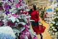 Woman in Christmas shopping buying decorations and ornaments