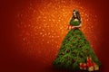 Woman in Christmas Tree Dress Holding Present Gift, Fashion Girl Royalty Free Stock Photo