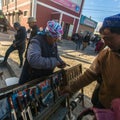 Woman in the city market sells daggers. In Bayan-Olgiy province is populated to 88,7% by Kazakhs.