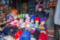 Woman in the city market sells winter hats. In Bayan-Olgiy province is populated to 88,7% by Kazakhs.