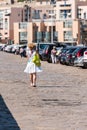 Woman on the city quay in Sete, France. Copy space for text. Vertical