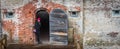 Woman at Civil War Fort standing at doorway