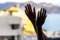 Woman clapping hands, applauding from balcony to support doctors, nurses, hospital workers. Applause to medical staff