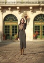 Woman in classic dress on street of an old tourist town