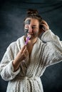 Woman with clay black and white mask on half face Royalty Free Stock Photo