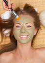 Woman with clay facial mask