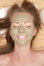 Woman with clay facial mask