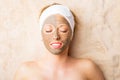 Woman with clay mask on her face