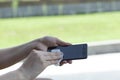 Woman clean phone in napkin