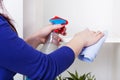 Woman cleaning bookstand