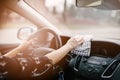 Woman cleaning car dashboard