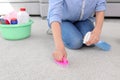 Woman cleaning carpet with brush Royalty Free Stock Photo