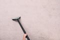 Woman cleaning carpet with vacuum cleaner, top view. Royalty Free Stock Photo