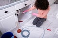 Woman Cleaning Clogged Sink Pipe Royalty Free Stock Photo