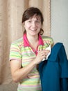 Woman cleaning coat