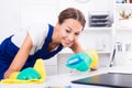 Woman cleaning in company office Royalty Free Stock Photo