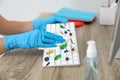 Woman cleaning computer keayboard from microbes at table in office, closeup Royalty Free Stock Photo