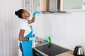 Woman Cleaning Cooker Hood With Rag Royalty Free Stock Photo