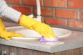 Woman cleaning counter with sponge in kitchen Royalty Free Stock Photo