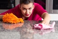 Woman is cleaning countertop Royalty Free Stock Photo