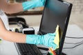 Woman Cleaning Desktop Screen With Rag Royalty Free Stock Photo
