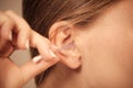 Woman cleaning ear with cotton swabs closeup Royalty Free Stock Photo