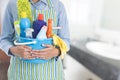 Woman with cleaning equipment ready to clean house Royalty Free Stock Photo