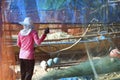 woman cleaning fish net ,after be back from fishing Royalty Free Stock Photo