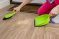 Woman cleaning floor with broom and dust pan Royalty Free Stock Photo