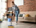 Woman cleaning floor with mop Royalty Free Stock Photo