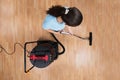 Woman Cleaning Floor With Vacuum Cleaner Royalty Free Stock Photo