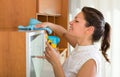 Woman cleaning furniture at home Royalty Free Stock Photo