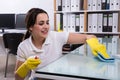 Woman Cleaning The Glass Office Desk With Rag Royalty Free Stock Photo