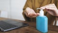 Woman cleaning hands with a hand sanitizer gel to prevent coronavirus contamination Royalty Free Stock Photo