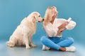 Woman cleaning her clothes from dog fur with adhesive roller Royalty Free Stock Photo