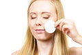 Woman cleaning her face skin with cotton pad Royalty Free Stock Photo