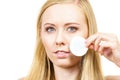 Woman cleaning her face skin with cotton pad Royalty Free Stock Photo