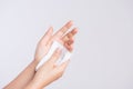 Woman cleaning her hands with a tissue. Healthcare and medical concept