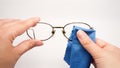 Woman cleaning his glasses Royalty Free Stock Photo