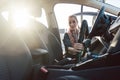 Woman cleaning inside of car