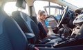 Woman cleaning inside of car