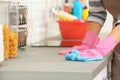 Woman cleaning kitchen counter with rag Royalty Free Stock Photo