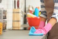 Woman cleaning kitchen counter with rag Royalty Free Stock Photo