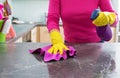 Woman cleaning kitchen counter