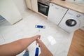 Woman cleaning kitchen floor Royalty Free Stock Photo