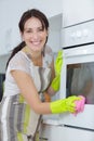 Woman cleaning kitchen young woman washing house