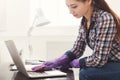 Woman cleaning laptop keyboard copy space Royalty Free Stock Photo