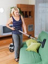 Woman cleaning living room