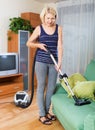 Woman cleaning living room